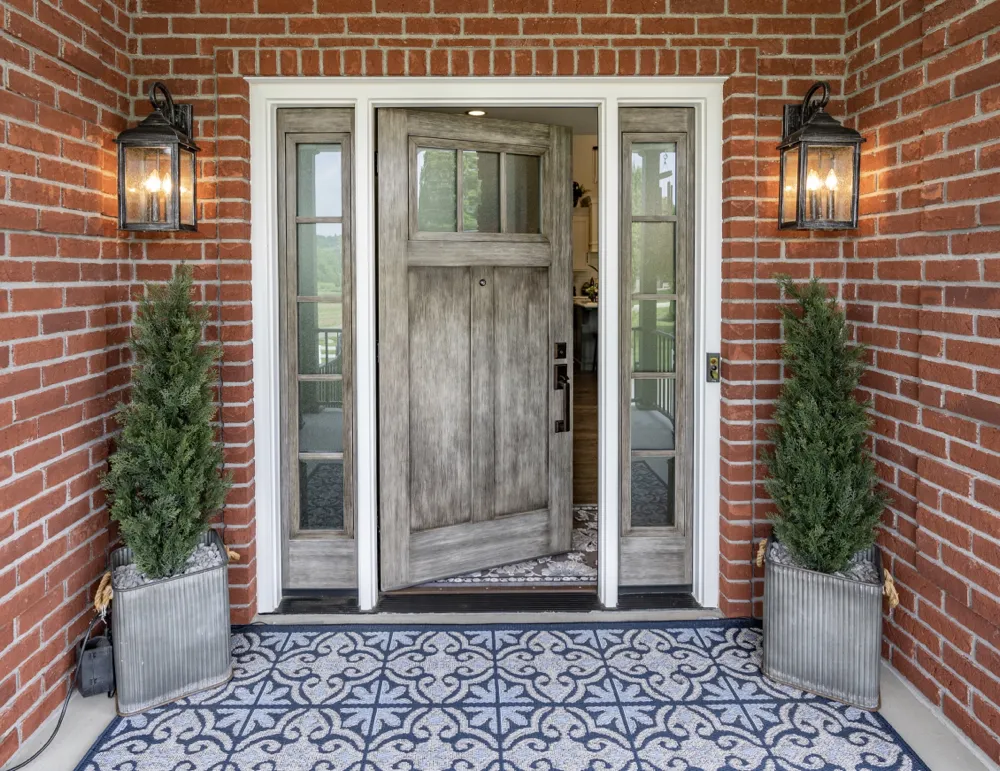 Sturdy Provia fiberglass entry door installed by Big Bend Roofing.